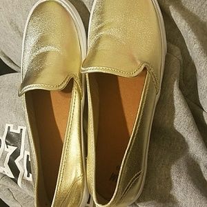 New, slip on gold shoes